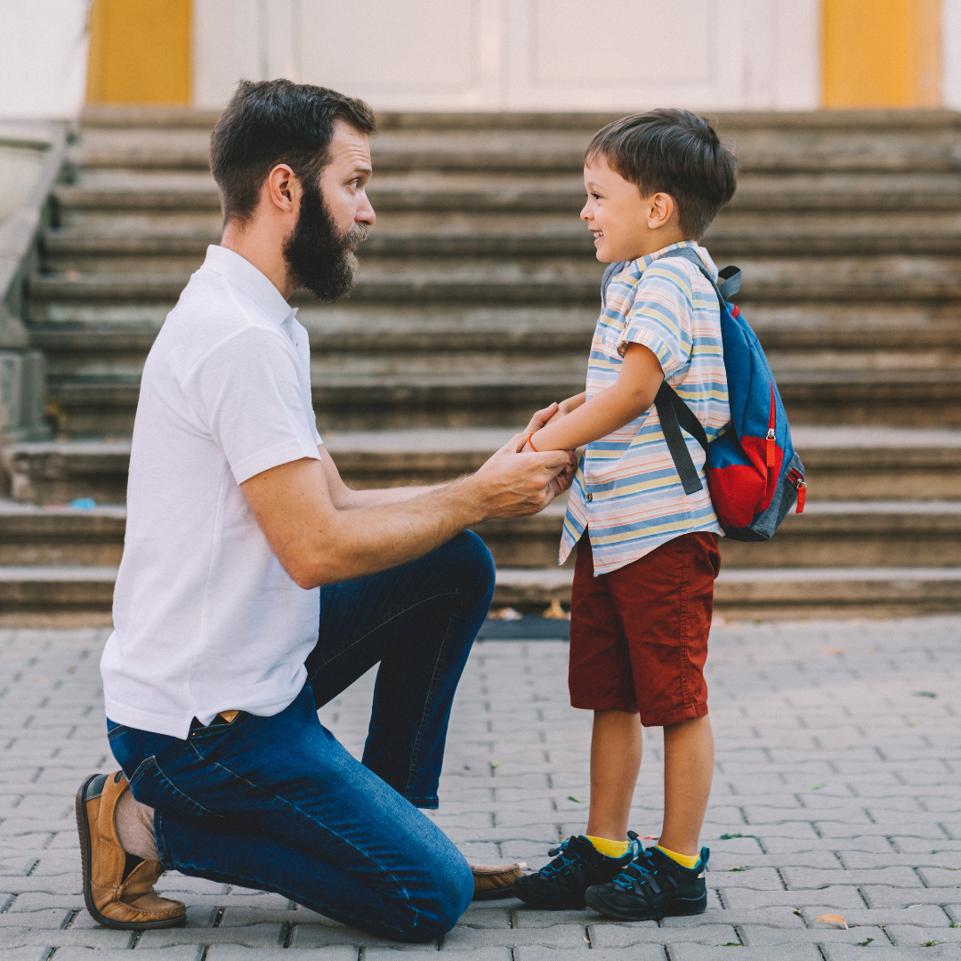 father and young son talking 