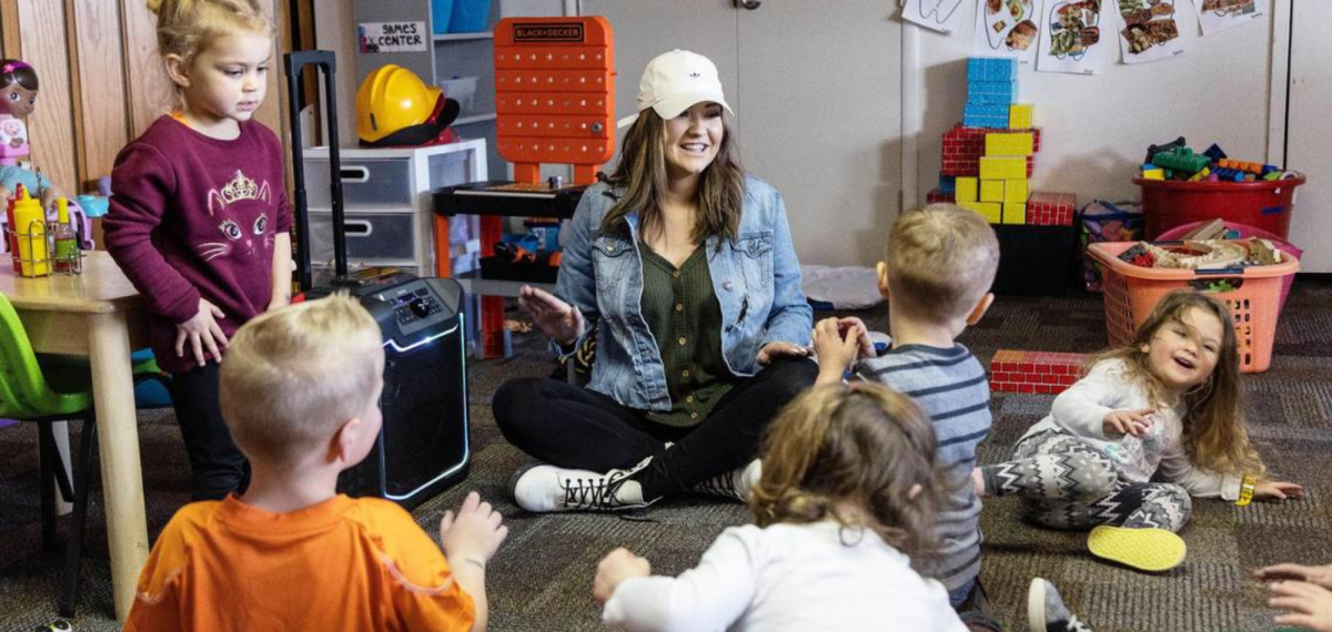 woman playing games with children