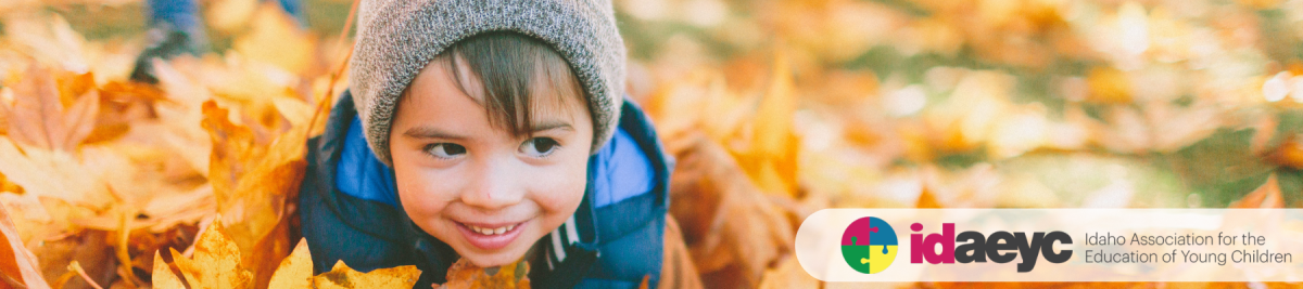 Child playing in leaves